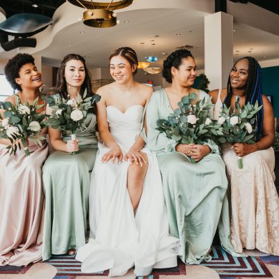 Bridesmaids in casino foyer.